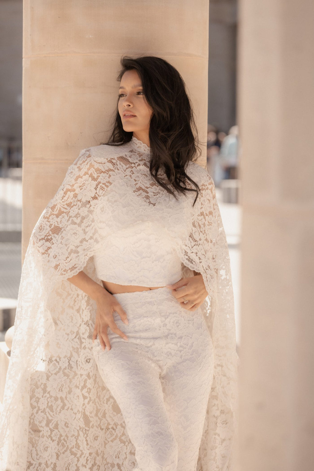 Close-up of the white French Chantilly lace and corset on the Femme Cape.