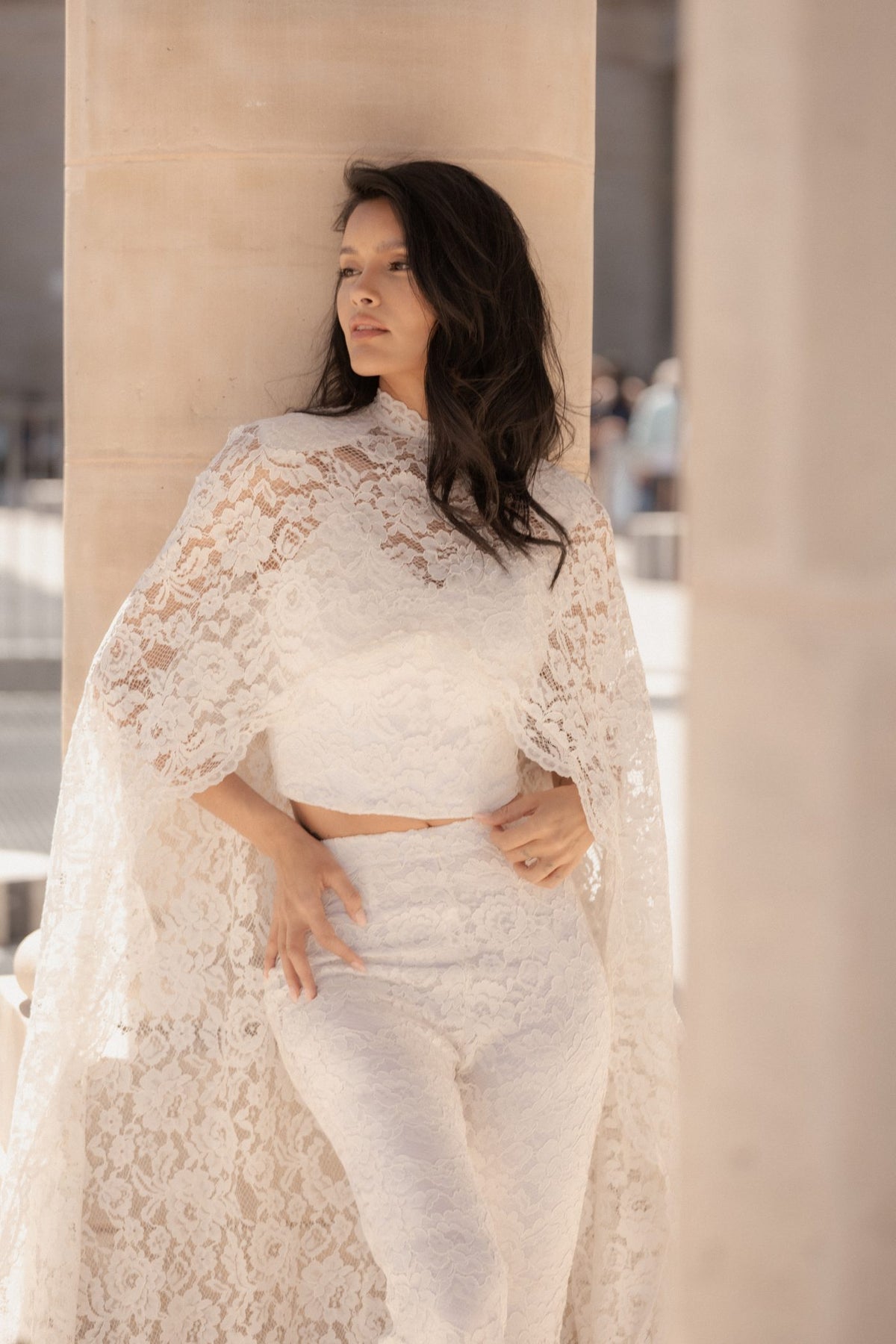 Close-up of the white French Chantilly lace and corset on the Femme Cape.